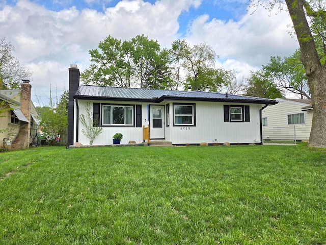 4518 Broadhurst Dr, Columbus, OH 43213 - ranch-style home with a chimney, a front yard, and metal roof