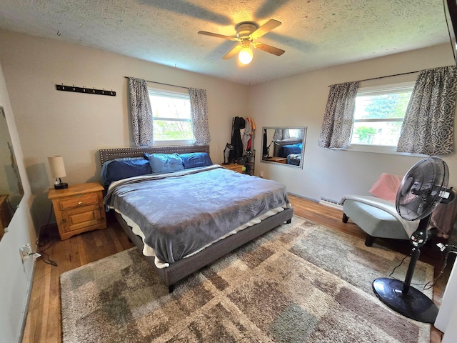 4518 Broadhurst Dr, Columbus, OH 43213 - bedroom with a textured ceiling, a ceiling fan, wood finished floors, and visible vents