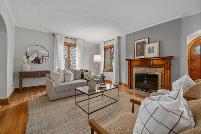 1920 Chatfield Rd, Columbus, OH 43221 - living area with wood-type flooring, crown molding, baseboards, a fireplace, and arched walkways
