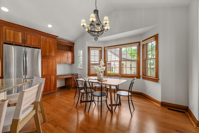 1920 Chatfield Rd, Columbus, OH 43221 - dining room with lofted ceiling, a chandelier, wood finished floors, baseboards, and recessed lighting