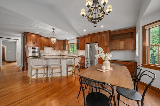 1920 Chatfield Rd, Columbus, OH 43221 - dining area with vaulted ceiling, a chandelier, light wood-style flooring, recessed lighting, and baseboards