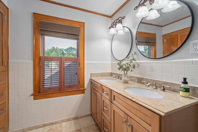 1920 Chatfield Rd, Columbus, OH 43221 - full bath with tile walls, double vanity, ornamental molding, wainscoting, and a chandelier