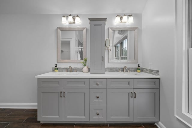 1920 Chatfield Rd, Columbus, OH 43221 - full bath with double vanity, baseboards, and wood finished floors