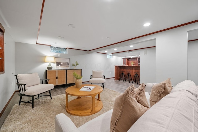 1920 Chatfield Rd, Columbus, OH 43221 - living room featuring a dry bar, recessed lighting, ornamental molding, baseboards, and wood finished floors