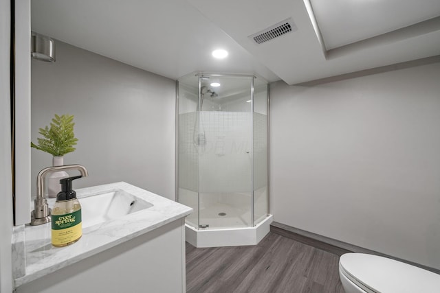1920 Chatfield Rd, Columbus, OH 43221 - full bath with wood finished floors, a shower stall, toilet, vanity, and recessed lighting