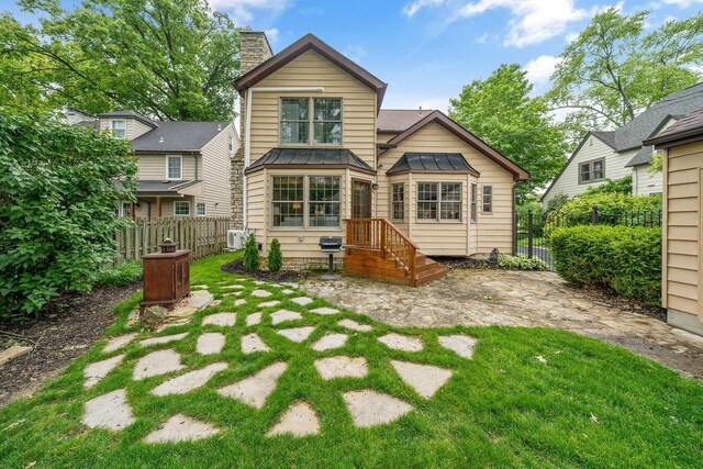 1920 Chatfield Rd, Columbus, OH 43221 - back of property featuring a standing seam roof, metal roof, and a chimney