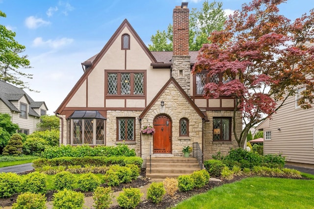 1920 Chatfield Rd, Columbus, OH 43221 - tudor home featuring stucco siding, stone siding, and a chimney