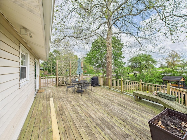 deck featuring outdoor dining area