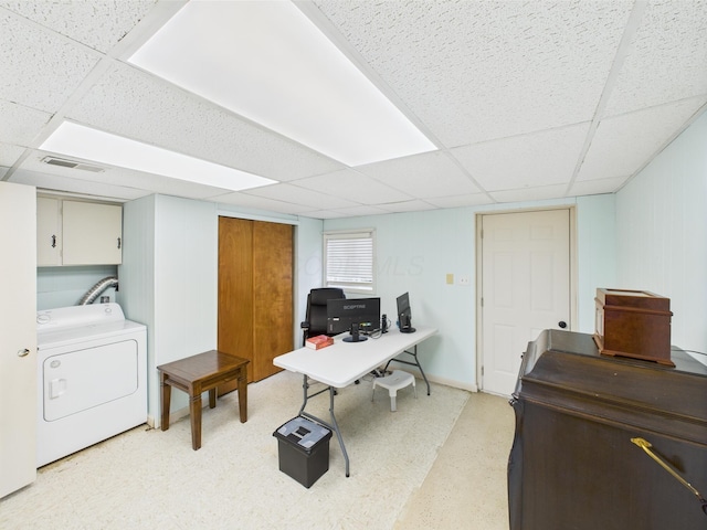 office space with visible vents, washer / clothes dryer, and a drop ceiling