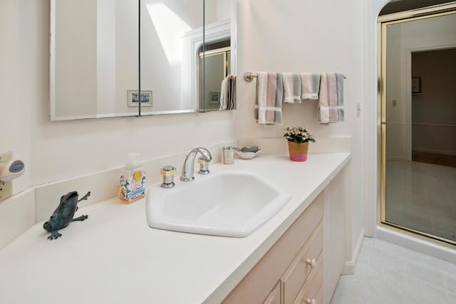 full bath featuring vanity and a shower with door