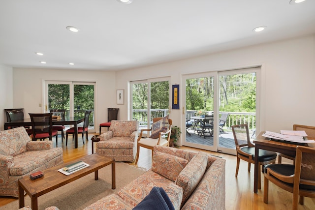 living room with recessed lighting and light wood-style flooring