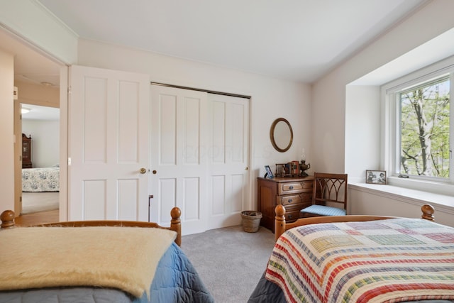carpeted bedroom with a closet