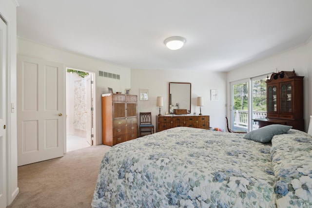 bedroom featuring visible vents, carpet flooring, and access to exterior
