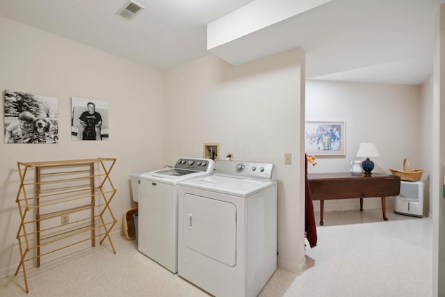 laundry area featuring visible vents, laundry area, and independent washer and dryer