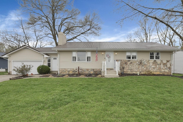 ranch-style house with a garage, stone siding, a front yard, a chimney, and metal roof