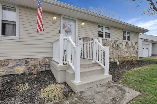 property entrance with stone siding