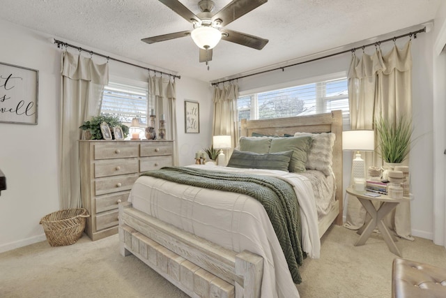 bedroom featuring baseboards, multiple windows, and light colored carpet