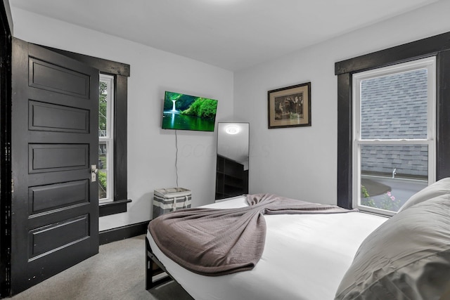 carpeted bedroom with baseboards
