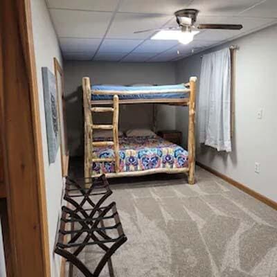 16900 Thompson Ridge Rd, Laurelville, OH 43135 - carpeted bedroom featuring baseboards, a paneled ceiling, and a ceiling fan