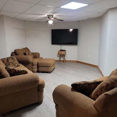 16900 Thompson Ridge Rd, Laurelville, OH 43135 - living area with wood finished floors, a drop ceiling, baseboards, and ceiling fan
