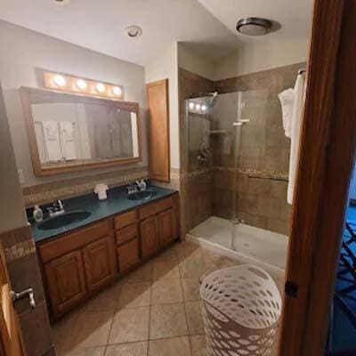 16900 Thompson Ridge Rd, Laurelville, OH 43135 - full bath with a sink, a stall shower, and tile patterned floors