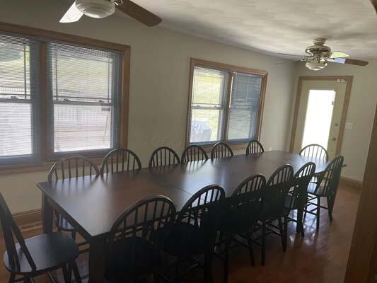 16900 Thompson Ridge Rd, Laurelville, OH 43135 - dining space featuring ceiling fan and wood finished floors