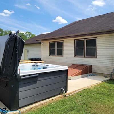 16900 Thompson Ridge Rd, Laurelville, OH 43135 - back of property with a hot tub and a yard