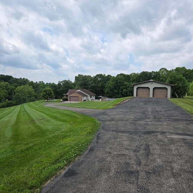 16900 Thompson Ridge Rd, Laurelville, OH 43135 - view of front of home with a front lawn and a view of trees
