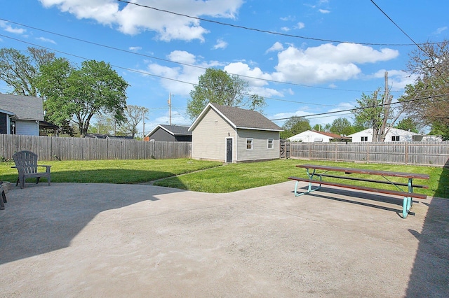 view of patio featuring a fenced backyard and an outbuilding
