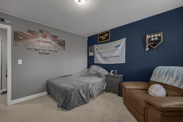 bedroom with baseboards and carpet flooring