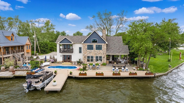 11290 Honeycreek Rd NW, Thornville, OH 43076 - back of house featuring a balcony, a patio, a chimney, and a water view