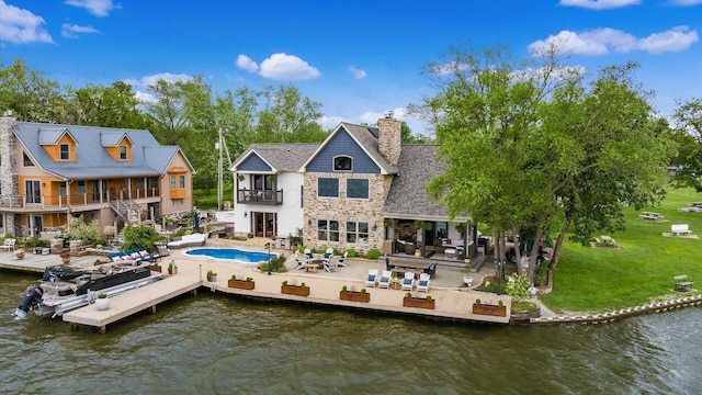 11290 Honeycreek Rd NW, Thornville, OH 43076 - back of property with a balcony, a patio area, a water view, and a chimney