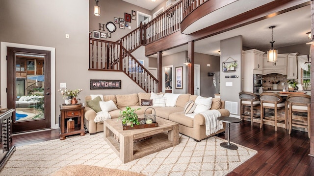 11290 Honeycreek Rd NW, Thornville, OH 43076 - living room featuring wood finished floors, stairway, and a high ceiling