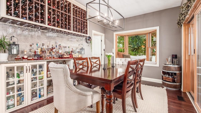 11290 Honeycreek Rd NW, Thornville, OH 43076 - dining room featuring wood finished floors, a chandelier, and baseboards