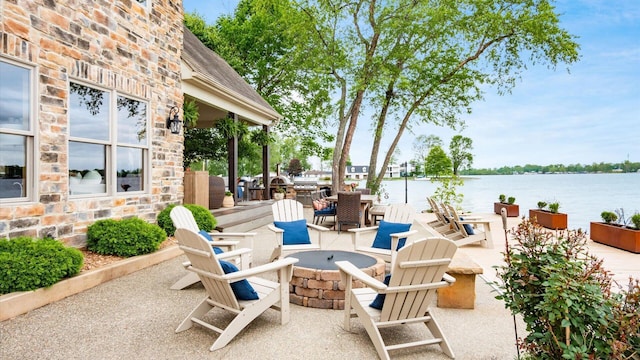 11290 Honeycreek Rd NW, Thornville, OH 43076 - view of patio / terrace featuring a fire pit and a water view