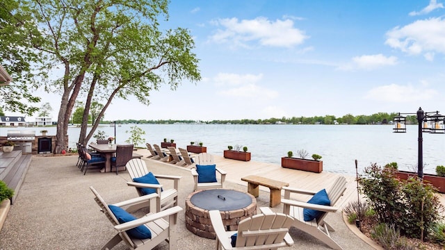 11290 Honeycreek Rd NW, Thornville, OH 43076 - view of patio / terrace featuring an outdoor fire pit, a water view, and area for grilling