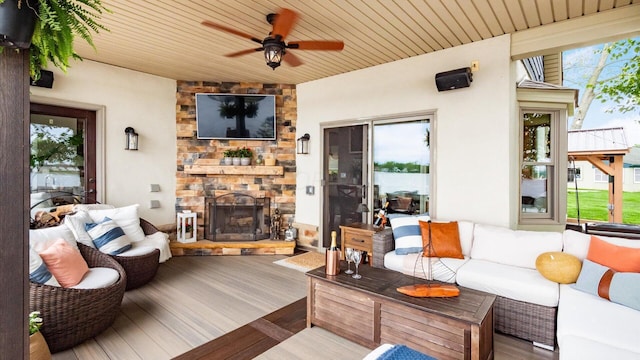 11290 Honeycreek Rd NW, Thornville, OH 43076 - living area featuring an outdoor stone fireplace, healthy amount of natural light, ceiling fan, wood finished floors, and wood ceiling