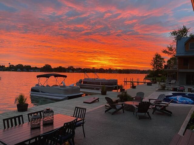 11290 Honeycreek Rd NW, Thornville, OH 43076 - view of patio featuring a dock, a water view, and boat lift