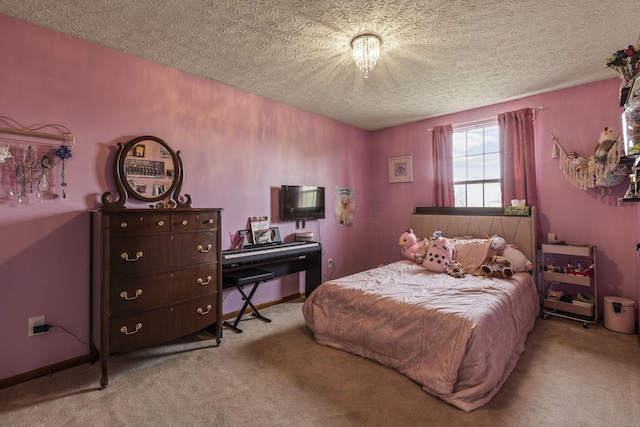 carpeted bedroom featuring a textured ceiling