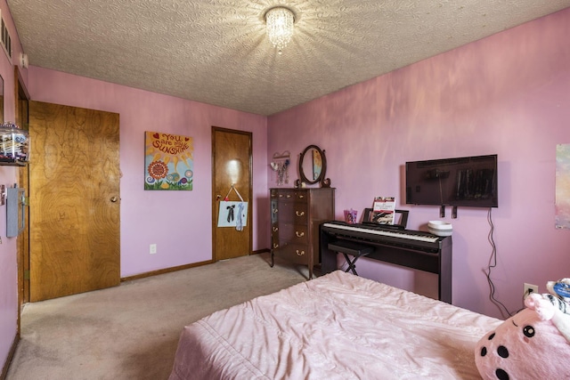 carpeted bedroom featuring a textured ceiling