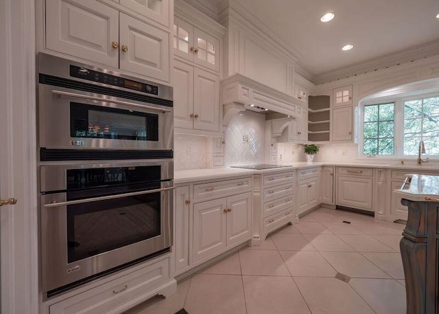 2528 Onandaga Dr, Upper Arlington, OH 43221 - kitchen with stainless steel double oven, light countertops, white cabinetry, and recessed lighting