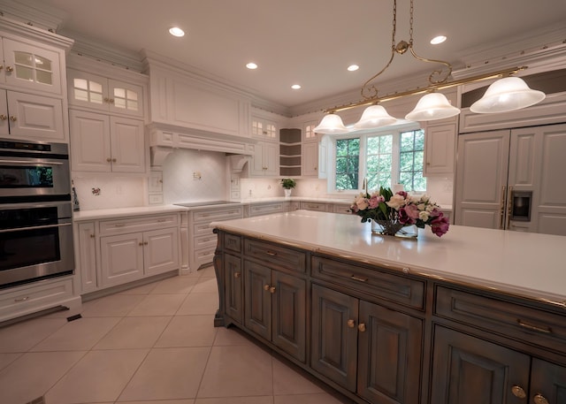 2528 Onandaga Dr, Upper Arlington, OH 43221 - kitchen with white cabinetry, light countertops, light tile patterned flooring, double oven, and glass insert cabinets