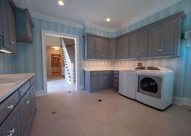 2528 Onandaga Dr, Upper Arlington, OH 43221 - laundry room featuring cabinet space, washing machine and dryer, wallpapered walls, ornamental molding, and baseboards