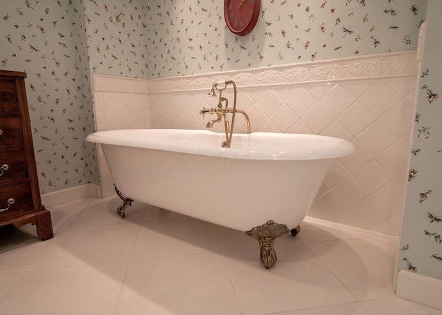 2528 Onandaga Dr, Upper Arlington, OH 43221 - bathroom featuring wallpapered walls, a wainscoted wall, a freestanding tub, and tile patterned flooring