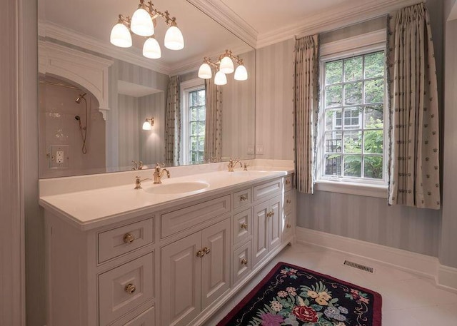 2528 Onandaga Dr, Upper Arlington, OH 43221 - full bathroom with ornamental molding, double vanity, baseboards, tile patterned floors, and a chandelier