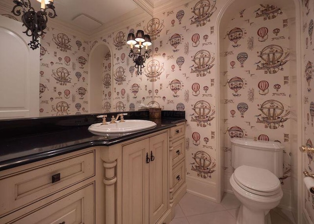 2528 Onandaga Dr, Upper Arlington, OH 43221 - bathroom featuring wallpapered walls, tile patterned floors, crown molding, vanity, and toilet