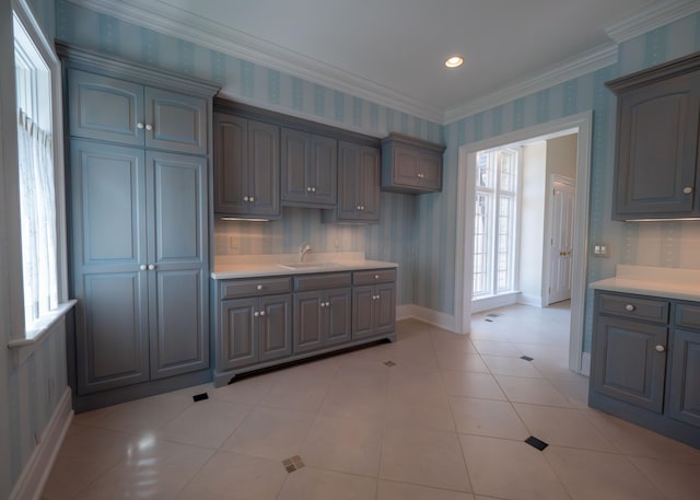2528 Onandaga Dr, Upper Arlington, OH 43221 - kitchen with a sink, wallpapered walls, light countertops, baseboards, and ornamental molding