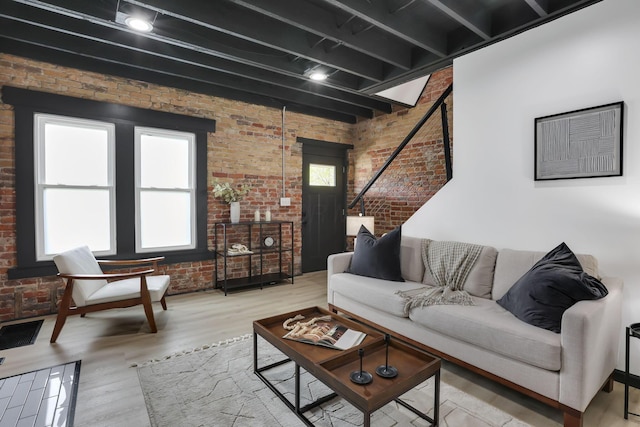 1010 Bruck St, Columbus, OH 43206 - living room featuring brick wall and plenty of natural light