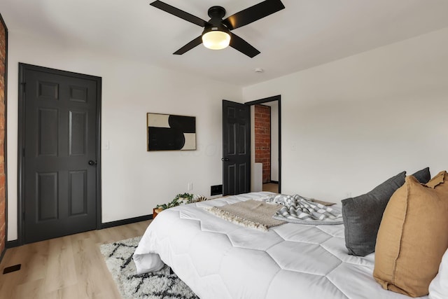 1010 Bruck St, Columbus, OH 43206 - bedroom featuring baseboards, light wood-style flooring, and ceiling fan