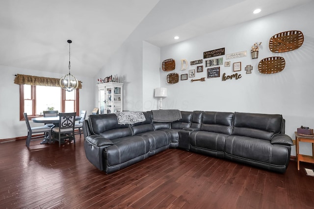 living room with an inviting chandelier, lofted ceiling, recessed lighting, and wood finished floors